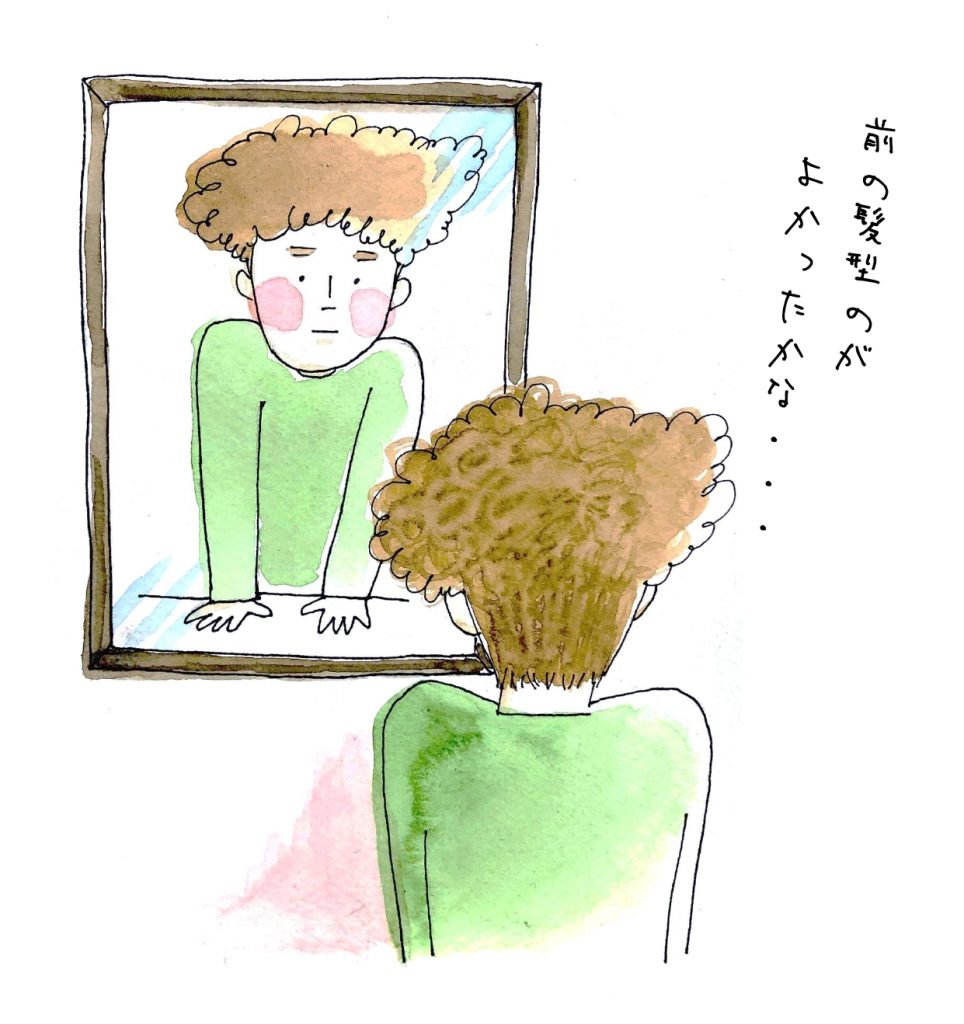 髪型を気にして鏡を見る人